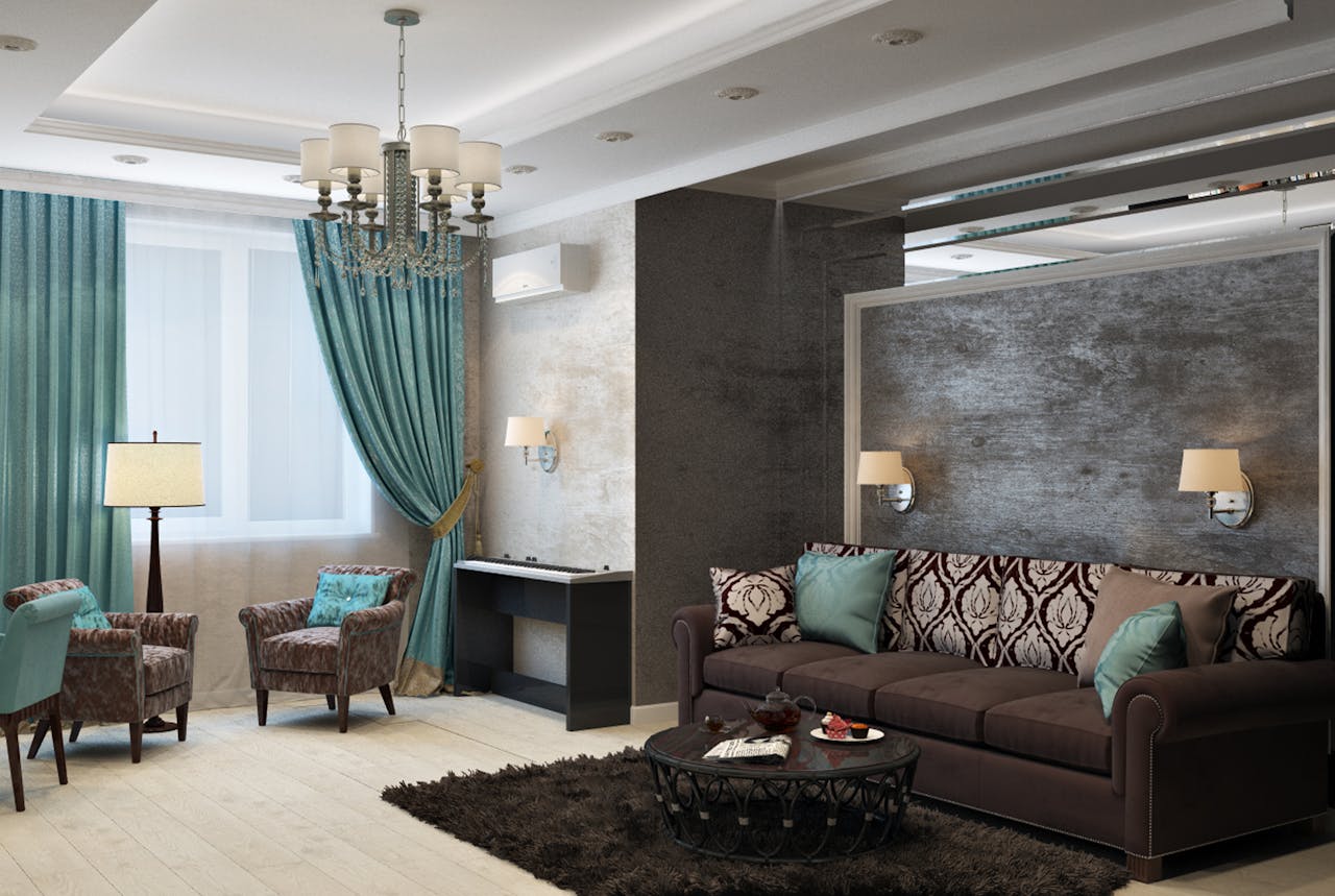 hero-img-01 Luxurious modern living room with chandelier, sofa, armchairs, and stylish decor.